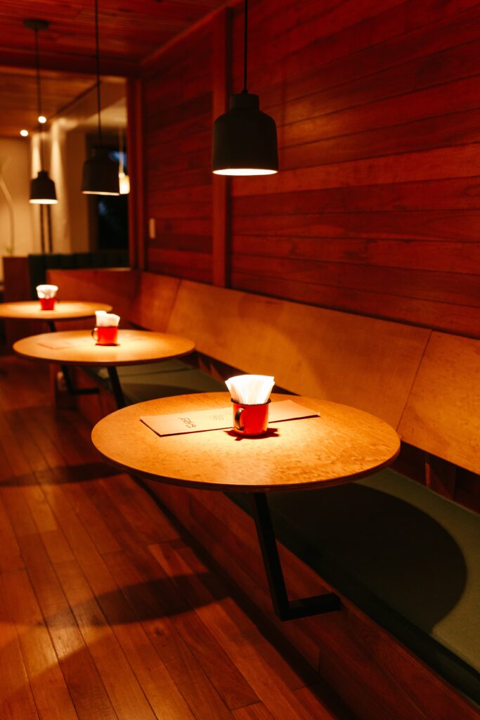 Pendant Light over restaurant table creates a focused light design